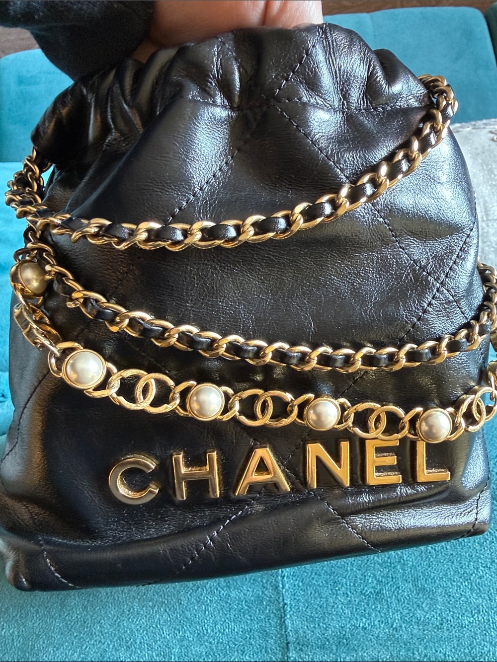 CHANEL 22 Black Quilted Leather Crossbody with Pearl-Trim Chain